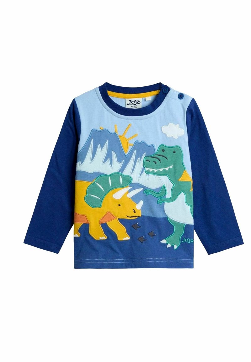 Pitkähihainen sininen t-paita, jossa on värikkäitä dinosauruksia, kuten keltainen triceratops ja vihreä T-Rex, vuoristomaisemassa.