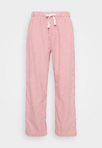 Punase ja valge triibuline pidžaamapüks, millel on mugav lõige, elastne vöökoht ja pael. Kerge kangas vertikaalse triibumustriga.