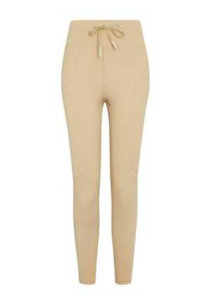 Beige leggings med høy midje, snøring og buede sidesømmer. Glatt tekstur og tettsittende silhuett.