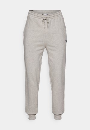 Grå mjukisbyxor gjorda av en mjuk bomullsblandning, med elastisk midja med dragsko, sidofickor och elastiska manschetter.