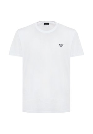 T-shirt bianca a maniche corte con scollo rotondo e piccolo logo aquila nera di Emporio Armani sul petto a sinistra.