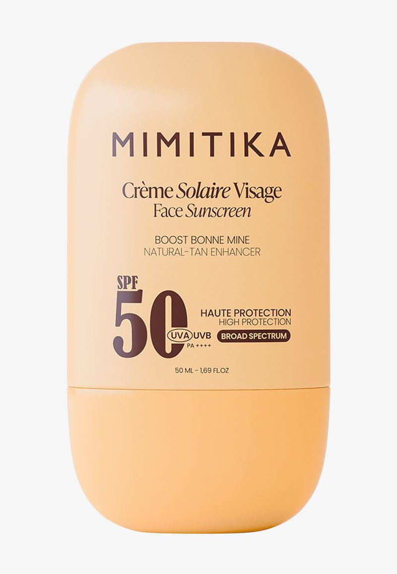 Mimitika gezichts zonnebrandcrème flesje met SPF 50, hoge bescherming, breed spectrum, natuurlijke bruiner, 50 ml, beige verpakking met zwarte tekst.
