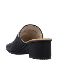 Black leather mule with a low block heel, featuring minimal stitching and a smooth texture. Inside has a beige lining.
