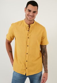 Niet geselecteerd, mustard color