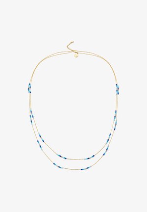 Guldhalsband med två strängar som har växelvis runda pärlor i nyanser av blått, turkos och mörkblått för en lagerlook.