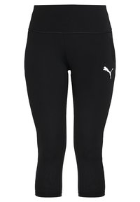 Czarne legginsy capri wykonane z elastycznego materiału z szerokim pasem w talii. Posiadają białe logo Puma po lewej stronie. Gładka tekstura.