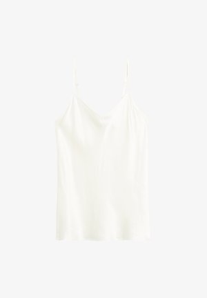 White cami top made of smooth fabric with thin adjustable straps and a V-shaped neckline. Simple, straight silhouette.