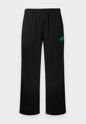 Svarte joggebukser med elastisk midje og avslappet passform. Har grønn logo tekst på venstre ben. Glatt stoff med matt tekstur.