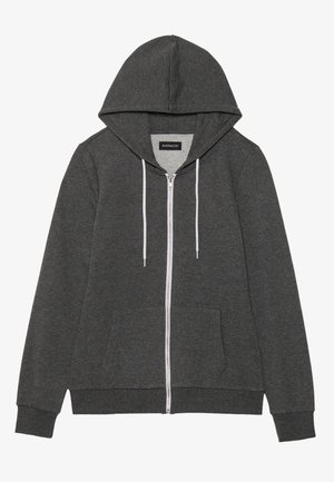 Haut à capuche zippé gris en tissu doux avec une capuche doublée, des poches avant et des cordons blancs. Comprend une fermeture éclair sur toute la longueur et des poignets en côte.