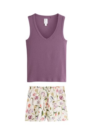 Ærmeløs lilla V-hals top kombineret med hvide shorts med farverigt blomsterprint og elastisk linning.