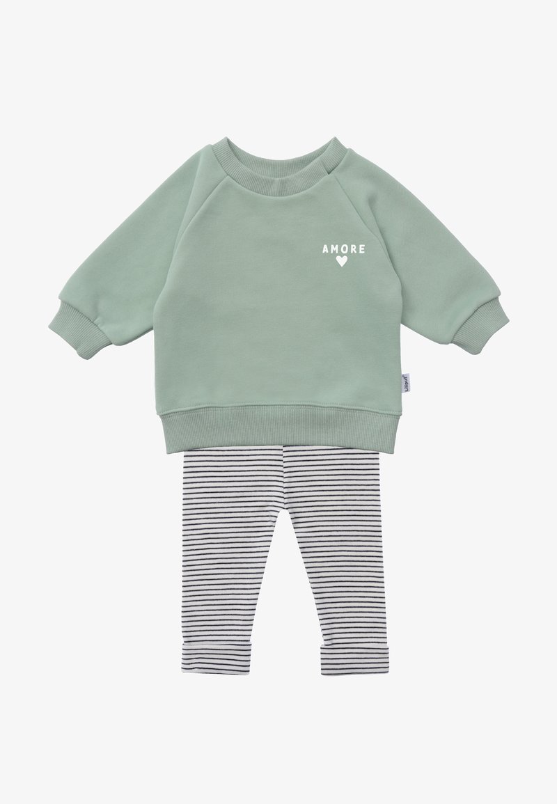 Mint green sweatshirt with "AMORE" text, paired with black and white striped leggings. Soft fabric, relaxed fit, ribbed cuffs and hem.