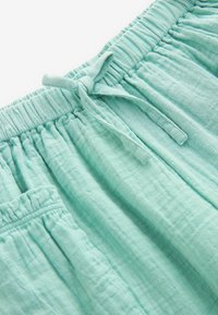 Next PULL-ON-REGULAR FIT - Träningsbyxor - teal blue