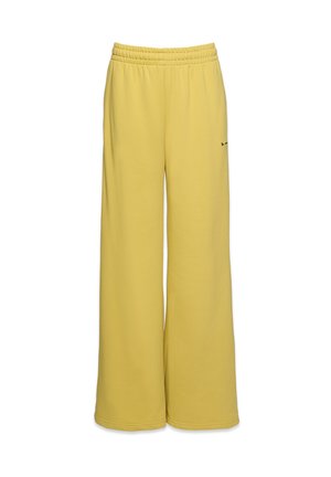 Žlté široké tepláky vyrobené z mäkkej tkaniny, s elastickým pásom a malým logom na spodnej strane.