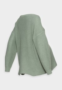 Hellgrüner, gestrickter Pullover mit lockerem Schnitt, übergroßen Ärmeln und strukturiertem Muster. Verfügt über einen weiten Ausschnitt und gerippte Bündchen.