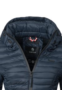 Navy puffer jacket with a high collar, featuring horizontal stitching, a front zipper, snap buttons, and a textured interior lining.