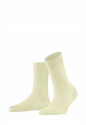 Chaussettes en coton jaune clair avec une texture lisse, des bords côtelés et un design classique de longueur équipage. Simples et uniformes en couleur.