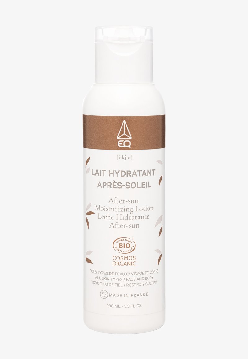 White bottle of organic after-sun moisturizing lotion with brown accents, labeled for all skin types, face and body, made in France, 100ml.