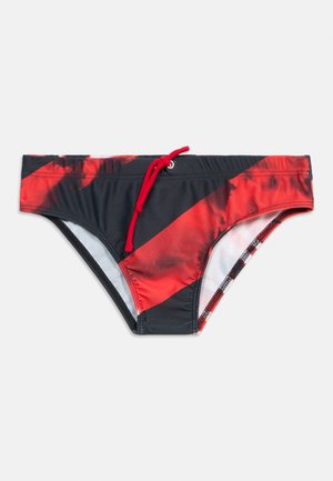 Black and red men's swim briefs with diagonal color block pattern and red drawstring at the waistband on a white background.