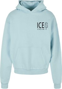 Light blue cotton hooded sweatshirt with a front pocket. Features black printed text saying "ICE CREAM" and a popsicle graphic.
