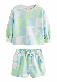 Lyseblå og grøn sweatshirt med blomstermotiv, lange ærmer og ribbet manchet, parret med matchende shorts med elastisk talje og sidelomme.