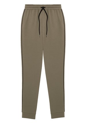 Pantalones de chándal verde oliva con cintura elástica, cordón negro, pierna ajustada, franjas laterales en contraste y puños acanalados. Hechos de una tela suave.
