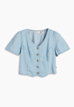 Light blue denim short-sleeve blouse with a deep V-neck, five brass buttons down the front, and a slightly cropped silhouette.