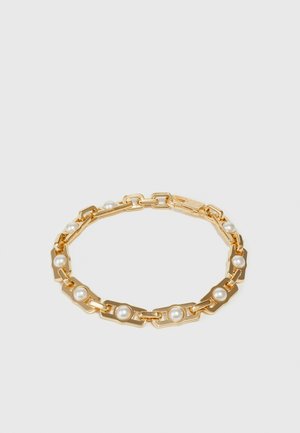 Gold chain bracelet featuring rectangular links interspersed with white pearls, creating a textured and contrasting design.
