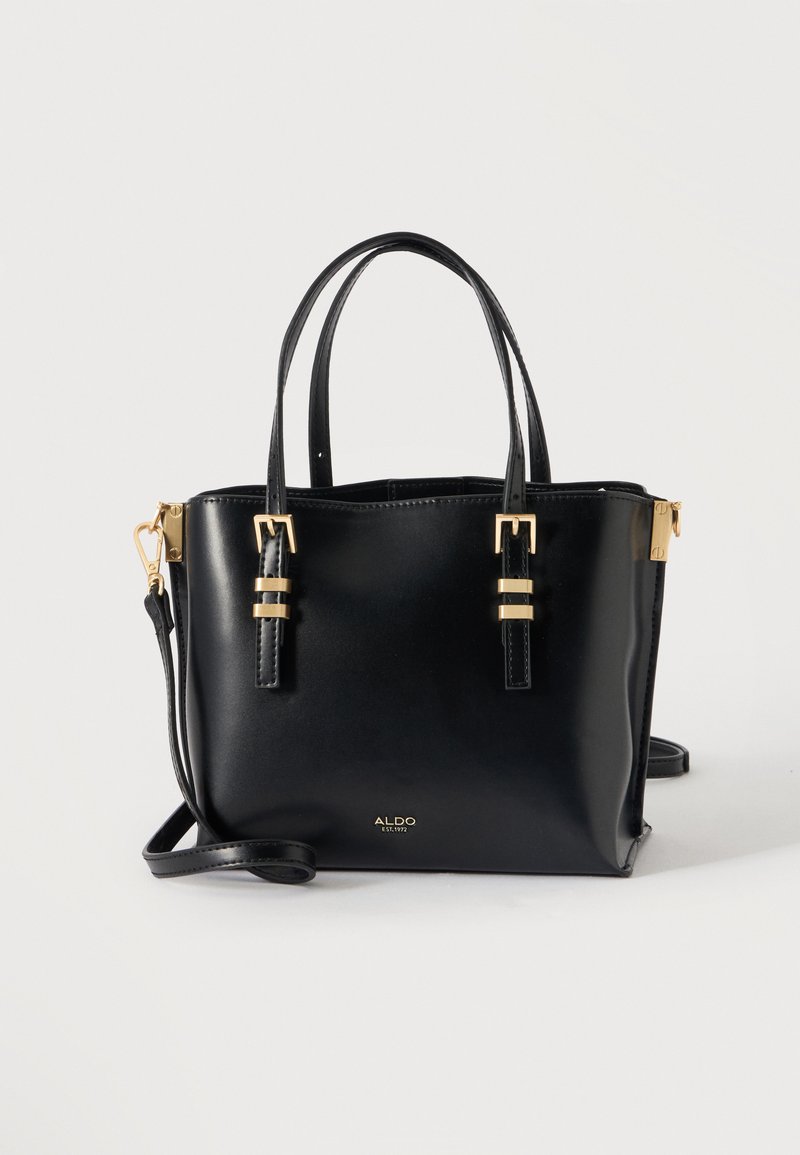Sac à main en cuir noir Aldo avec double poignées supérieures, accents de boucles dorées et bandoulière amovible sur fond blanc.