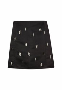 Mini-jupe noire avec de petites ornements en strass argentés dispersés en motifs verticaux et groupés.