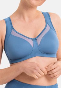 Light blue bra with a smooth, stretchy fabric. Features mesh panels, wide straps, and a front closure. Simple design and comfortable fit.