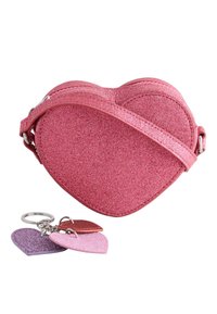 Pink glittery heart-shaped bag with a matching strap, featuring three heart-shaped keychains in pink, purple, and red. Smooth texture.