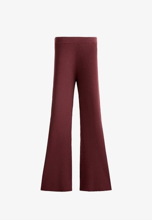 Bordeaux punttihousut, jotka on valmistettu ribbitetystä kankaasta. Niissä on leveä vyötärö ja teksturoitu kuvio koko lahkeissa.