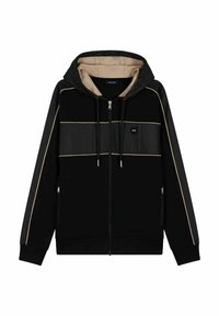 Haut à zip noir avec une capuche beige, présentant des panneaux noirs et des accents beige clair. Comprend deux poches latérales et des cordons de serrage.