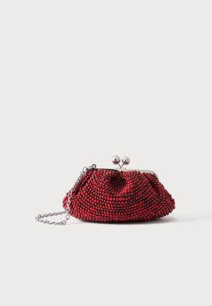 Small red beaded clutch purse with silver clasp and chain strap on a plain white background.
