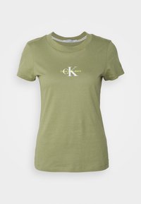 T-shirt en coton vert olive avec un col rond, des manches courtes et un logo blanc portant "Calvin Klein Jeans" dans un design contrasté.