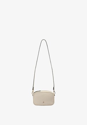 Petit sac bandoulière rectangulaire beige en cuir avec une longue sangle fine noire et une fermeture éclair.