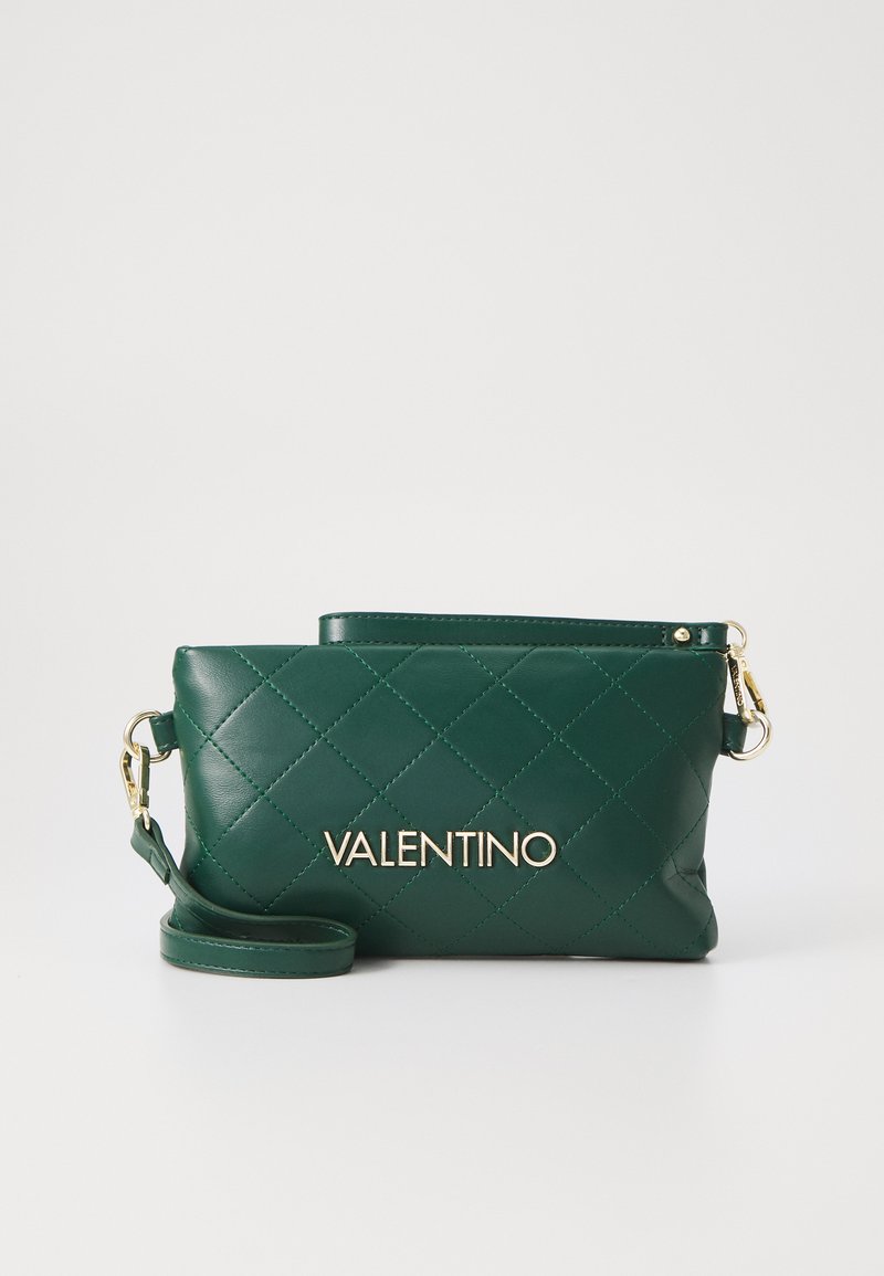 Green quilted leather bag with gold hardware, featuring a zip-top closure and detachable strap. "VALENTINO" logo prominently displayed.