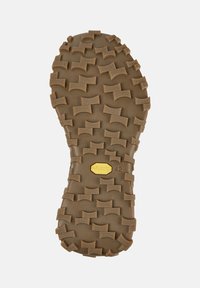 Sole of a brown Vibram shoe with textured, multi-directional tread pattern for enhanced grip, displaying size number 42.