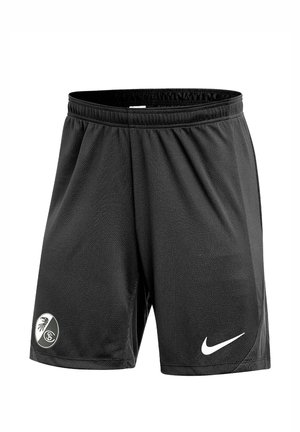 Sorte sportsshorts med elastisk linning, med en hvid Nike-logo på højre ben og et sort-hvidt klubemblem på venstre ben.