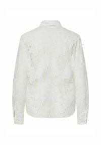 Witte langemouwen shirt met een bloemenkantstructuur, voorzien van een kraag en knoopmanchetten. De achterkant toont een subtiel ontwerp.