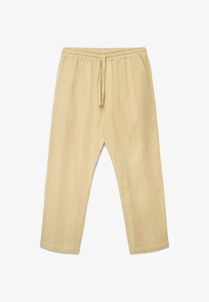 Pantaloni beige in maglia strutturata con vita elastica e coulisse, dotati di tasche laterali e taglio a gamba dritta.