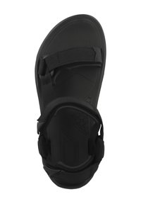 Musta sandaali, jossa on teksturoitu pohja, säädettävät remmit jalan yli ja pehmustettu ankle-tuki mukavuutta ja vakautta varten.