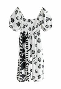 Svart och vit blommig klänning med puffärmar, smockad bodice, knälång silhuett och kontrasterande mönster på kjoldelen.