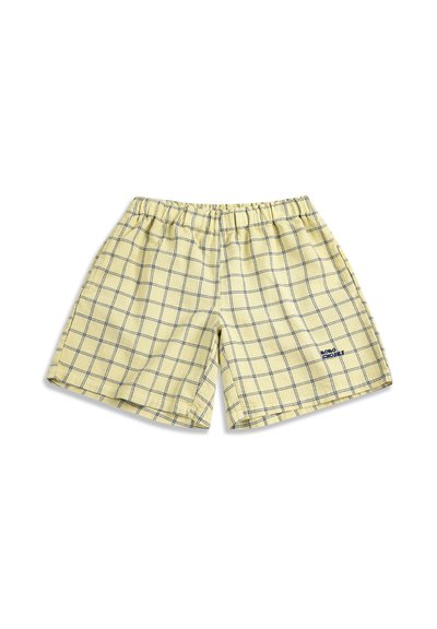 Shorts jaune clair avec taille élastique, motif carreaux bleu marine, et petit logo bleu marine sur la jambe droite en bas.