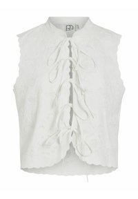Blouse blanche sans manches avec broderies florales, bords festonnés et fermeture avant nouée. Fabriquée à partir d'un tissu léger et texturé.