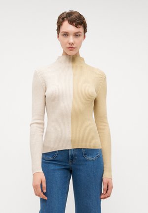 Ribbestrikket høyhalset genser med to-farget design i beige og lys tan. Fitted fasong og lange ermer, teksturert stoff, ensfarget finish.