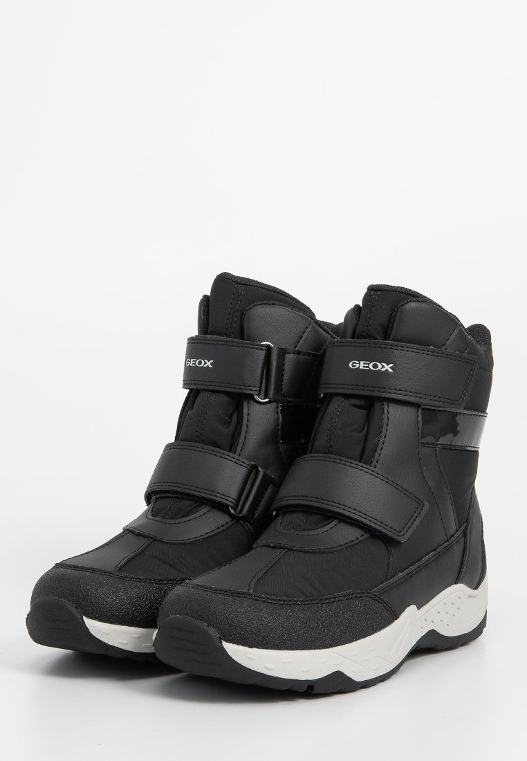 Schwarze Knöchelstiefel mit zwei Klettverschlüssen, Obermaterial aus Nylon und Synthetik, Gummisohle und strukturierten Details an Zehen und Ferse.