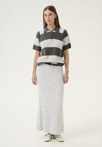 Gray and white striped short-sleeve knit top with a collar, paired with a long, ribbed gray skirt. The outfit features a black belt.