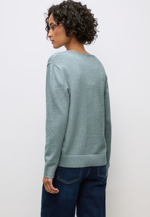 Helles grünes Sweatshirt mit Rundhalsausschnitt, langen Ärmeln und geripptem Saum. Aus weichem Material gefertigt, mit glatter Textur und lockerer Passform.