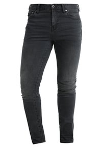 Jeans ajustados negros con cinco bolsillos, cierre de botón y cremallera, y un desgastado sutil en los muslos y las rodillas.